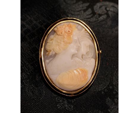 A Carved Cameo Brooch with twin portrait busts of young ladies in gold mount.