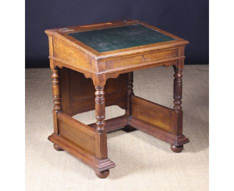 A Pair of 19th Century Gillows Oak Clerk's Desks originating from Lancashire Town Hall. Each desk having a hinged slope top r