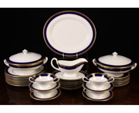 A Good Quality Royal Worcester Bone China 'Empire Blue' part Dinner Service; the rich blue borders enhanced with gilding. Com