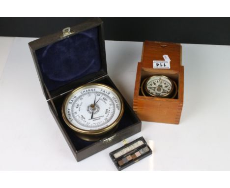 A cased brass barometer by Philip Harris &amp; Co of Birmingham together with a brass compass and a metal sample box. 