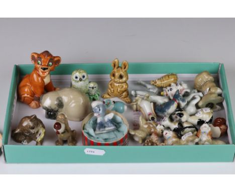 A collection of Wade whimsies and Wade Disney character figures together with other ceramic ornaments. 
