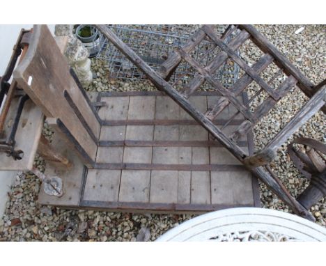 An antique wooden trolley / wheel barrow together with a set of sack scales. 