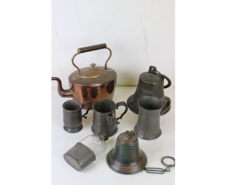 A collection of mixed metal ware to include pewter tankards, copper kettle, Brass bells and a hip flask 