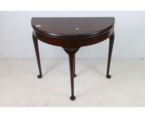 George III style Mahogany Demi-Lune Fold Over Card Table raised on turned cabriole legs with pad feet, 69cms wide x 71cms hig