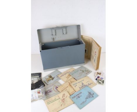 A collection of cigarette cards within original albums together with a good quantity of loose examples. 