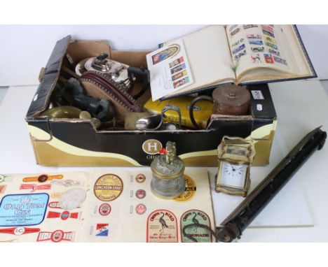 A box of mixed collectables to include an inkwell with cherub decoration, bellows, postal scales, carriage clocks, brass pest