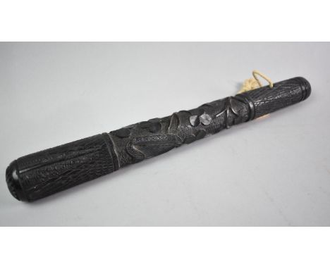 An Irish Carved Bog Oak Truncheon Decorated with Shamrock and irish Harp, 36cms Long