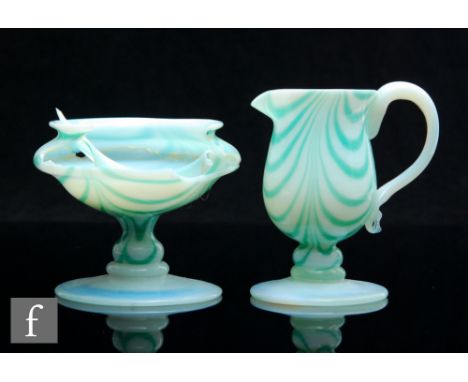 A 1930s Gray-Stan cream and sugar set of pedestal form, decorated with a green Nailsea style loop over an opal ground, talles