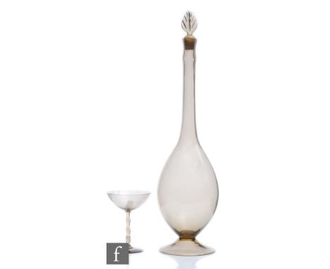 A 1920s Orrefors Astrid decanter designed by Simon Gate, the lightweight mauve-tinted&nbsp; decanter and matching cocktail gl