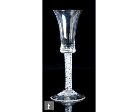 An 18th Century drinking glass, circa 1755, the flared bucket bowl above a double series air twist stem with a pair of three 