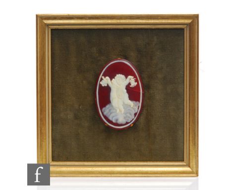 A late 19th Century Thomas Webb &amp; Sons Cameo glass plaque, the plaque of oval section cased in opal over ruby and cut wit