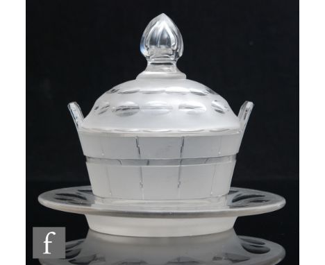 A 19th Century clear crystal glass butter dish in the form of a coopered barrel with cut and polished detail, a domed and fin