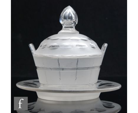 A 19th Century clear crystal glass butter dish in the form of a coopered barrel with cut and polished detail, a domed and fin