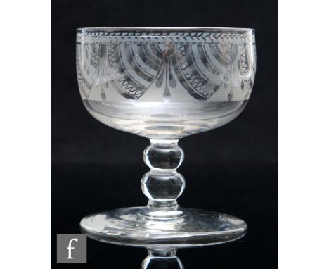 An early 19th Century Davenport Patent rummer, the cup bowl acid etched with swags and tassels, above a bobbin stem and raise