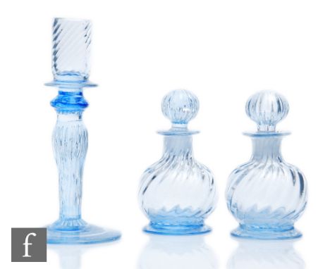 A pair of 1930s Gray-Stan scent bottles, of footed squat ovoid form, with wrythen moulded decoration, complete with matching 
