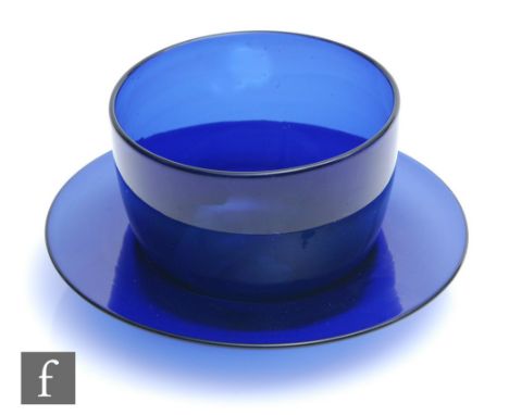 A late Georgian Bristol Blue finger bowl and stand, circa 1800, the plain circular bowl to a matched plain wide rimmed dish, 
