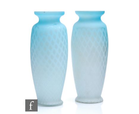 A pair of late 19th Century Stourbridge quilted air trap satin glass vases of footed barrel form with everted collar necks, c