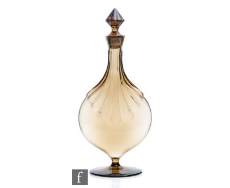 A 1920s Swedish Orrefors/Sandvik decanter designed by Simon Gate, the bellows shaped decanter in smoke amber, the broad faces