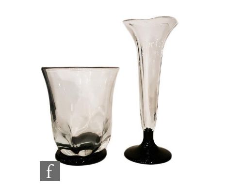 A 1930s Orrefors clear crystal glass vase designed by Edward Hald, with a lobed body and flared rim, mounted to a circular bl