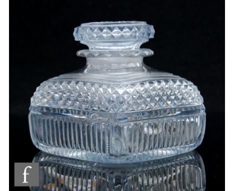 A late Georgian Anglo-Irish clear crystal glass tea caddy of rounded square section with mitre and strawberry diamond cut bod