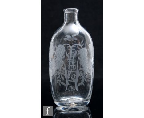 A late Georgian clear crystal glass spirit flask, circa 1820, the compressed ovoid body with shallow collar neck, engraved wi