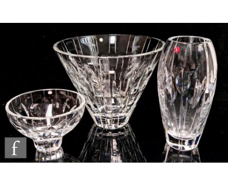 A small collection of three Stuart and Sons glass vases, designed by John Luxton comprising a vase of conical form in the Edg