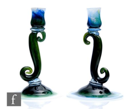 A pair of 1930s Gray-Stan glass candlesticks, the upper sconce supported by an S form scroll above a domed foot with graduate