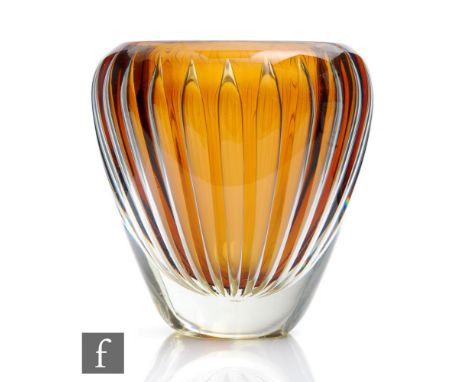 An Ariel vase by Kaj Franck for Nuutajarvi circa 1950, compressed ovoid body cased in clear crystal over a deep golden amber 