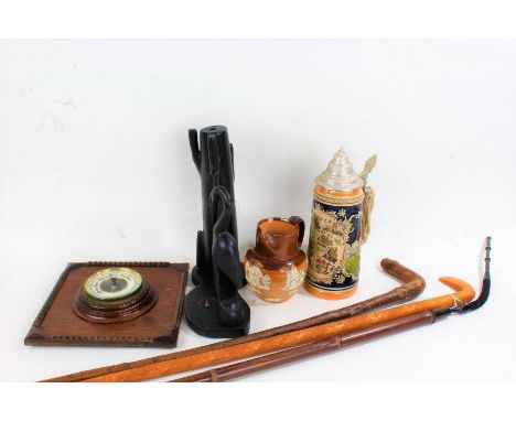 Mixed works of art, to include an Eastern papier mache dancing figure, carved ebony table lamp base, German stein, two walkin