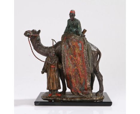 After Franz Bergman, an early 20th century cold painted spelter petrol striker table lighter of a camel with carpet sellers. 