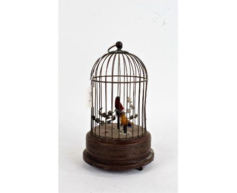 Victorian style singing bird automaton, within a gilt metal cage, 27cm tall excluding loop