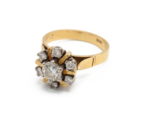 An 18ct yellow gold and diamond cluster ring, the central round brilliant cut diamond approximately 0.50ct, surrounded by six