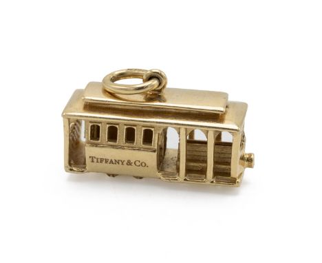 Tiffany &amp; Co - An 18ct yellow gold charm, modelled as a tram, set with a single round brilliant cut diamond to the front 