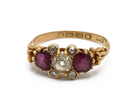 A Victorian 18ct yellow gold diamond and ruby ring, the principal old cut diamond approximately 4.6mm x 5mm x 3.25mm, flanked