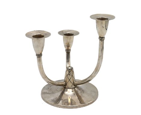 A silver three light candelabrum, the curved branches supporting the candle holders at differing levels, raised on a stepped 