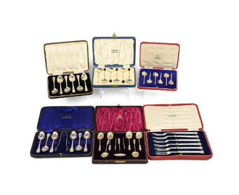 A set of silver and enamel bean end coffee spoons, each with enamel back of a dancing lady, in a Harrods box, along with thre