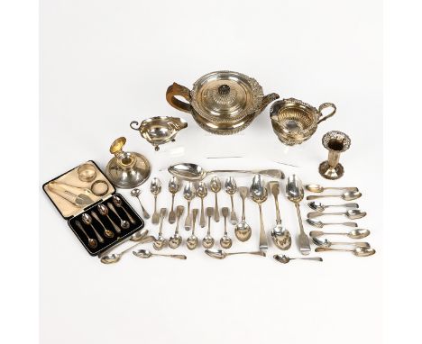 A collection of miscellaneous silver items to include a three piece silver tea set, various cutlery, inkwell and other items,