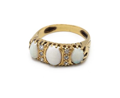 A 1960s 18ct yellow gold opal and diamond ring, in the Victorian style, set with three oval cabochon opals, and six single cu