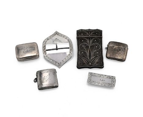 An unmarked silver filigree card case, with vacant cartouche, two silver vesta cases, a silver snuff box and silver belt buck