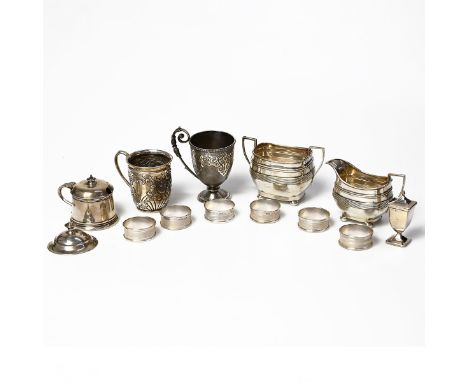 A collection of miscellaneous silver items including matching silver cream jug and sugar bowl, five napkin rings, two silver 