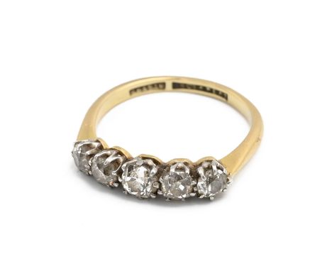 An 18ct yellow gold and diamond five stone ring, graduated old cut diamonds in platinum settings, ring size P, total gross we