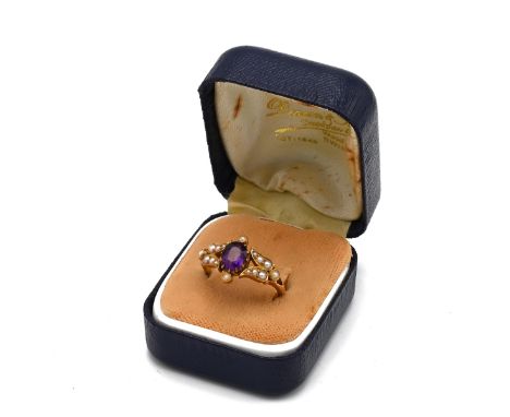 An 18ct yellow gold amethyst and seed pearl ring, ring size M, total gross weight approximately 3.9g. (J)