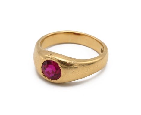 An 18ct yellow gold gentleman's gem set ring, set with a round cut synthetic ruby, ring size W, total gross weight approximat