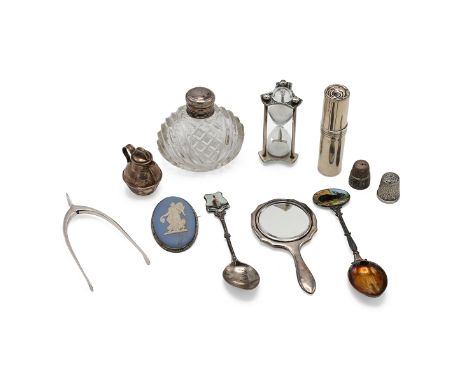 A collection of miscellaneous silver items to include miniature hand mirror, lipstick holder, Jersey milk can, two silver ena