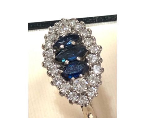 Fine 18ct white gold diamond and sapphire ring set with 3 central sapphires centre sapphitre measure approx 8mm by 4mm with e