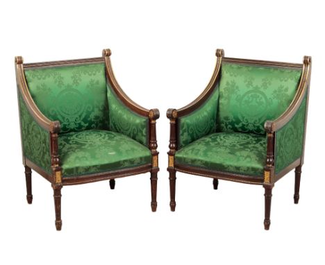 A PAIR OF REGENCY MAHOGANY AND PARCEL GILT ARMCHAIRS early 19th century, the square fluted top rail over a bow-fronted seat, 