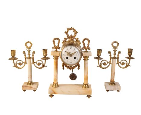 A LATE 19TH CENTURY FRENCH MANTEL CLOCK AND GARNITURE the clock with two train movement, white enamel dial and black Arabic n