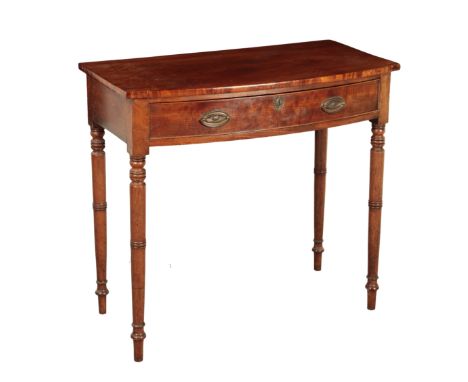 A REGENCY MAHOGANY BOW FRONT SIDE TABLE early 19th century, on turned tapering legs, 83cm high x 92cm wide x 50cm deep
