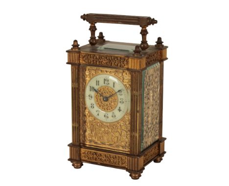 A FRENCH CARRIAGE CLOCK the cream enamel chapter ring with Arabic numerals, within a gilt fretwork mask, in a brass case with