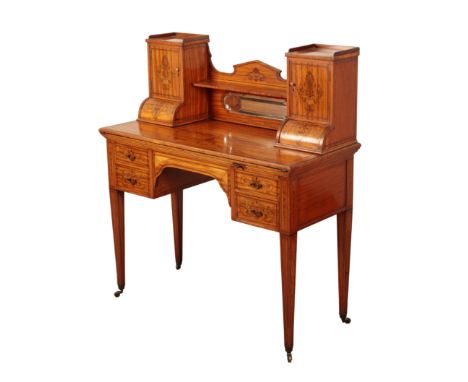 AN EDWARDIAN SATINWOOD AND MARQUETRY DESK early 20th century, the galleried top section with shelves and small cupboards flan